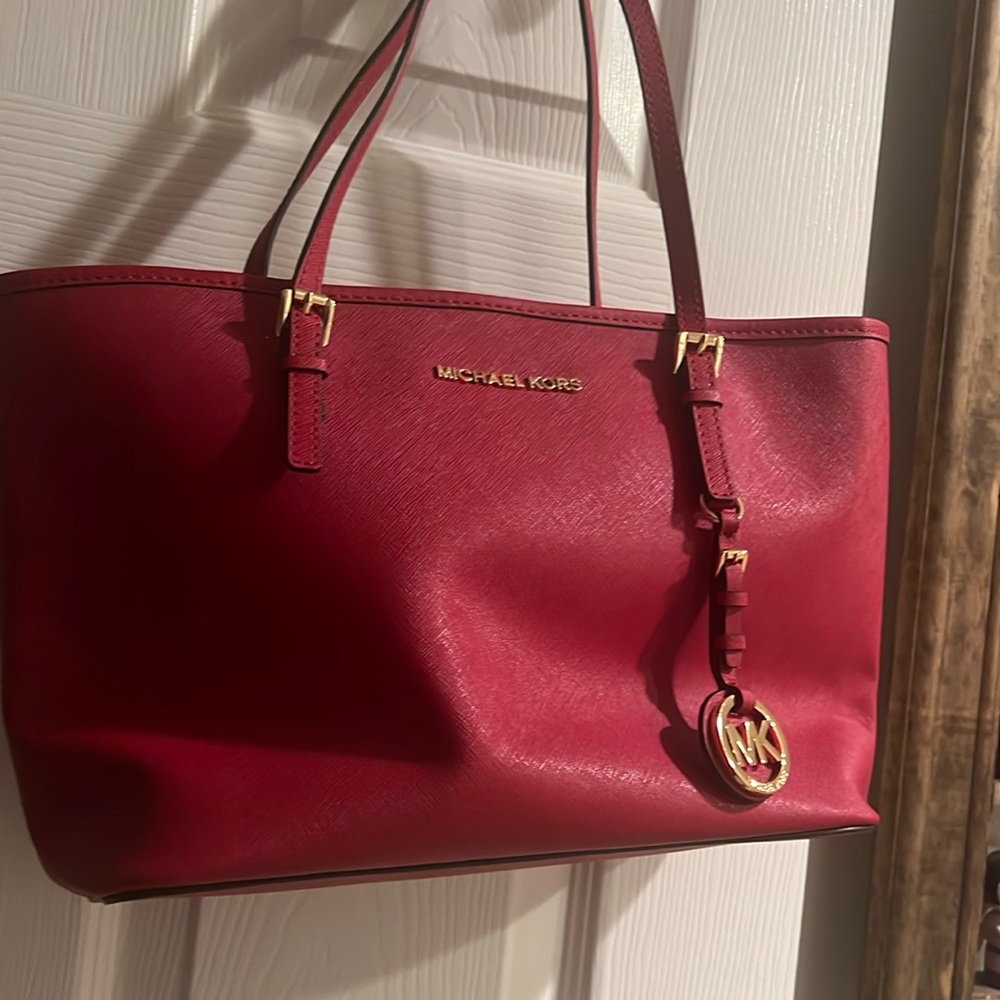 NWT red Michael Kors handbag.